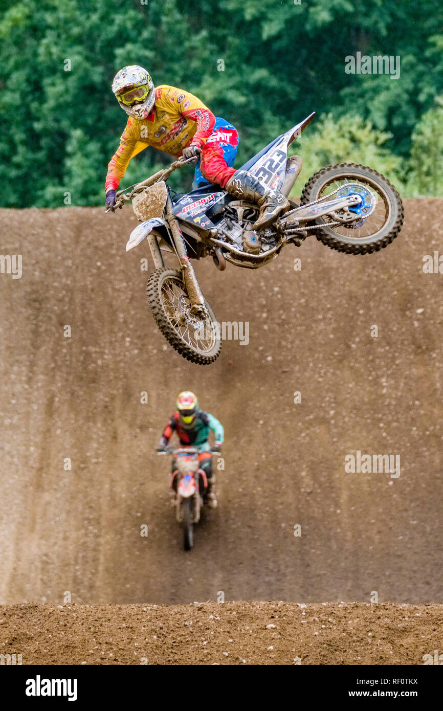 Riders on 250 cc motocross bikes jumping at Deutsche Meisterschaft at