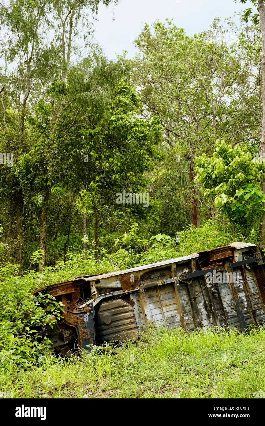 Flip over and abandoned car wreck in a forest, Mia Mia State Forest, Queensland, Australia Stock Photo