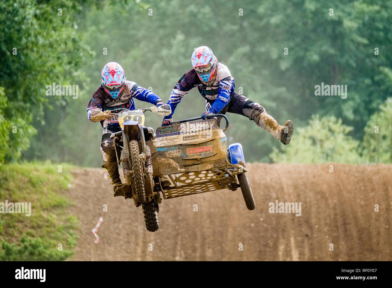 Riders on sidecar motocross bikes jumping at Deutsche Meisterschaft at the motocross circuit Am Osterreicher Stock Photo Alamy