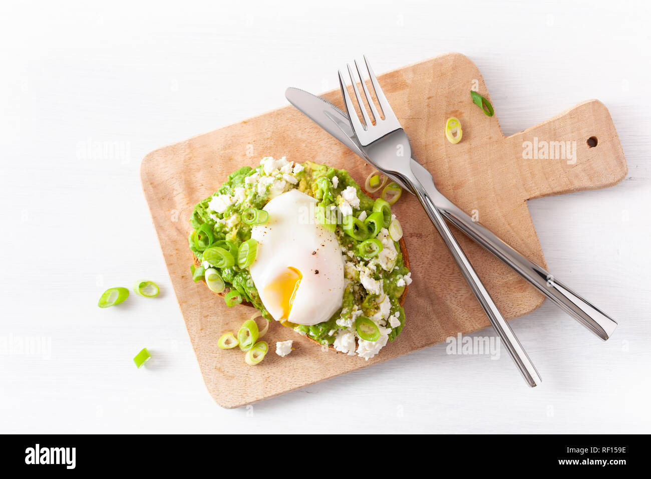 breakfast avocado sandwich with poached egg and feta cheese Stock Photo