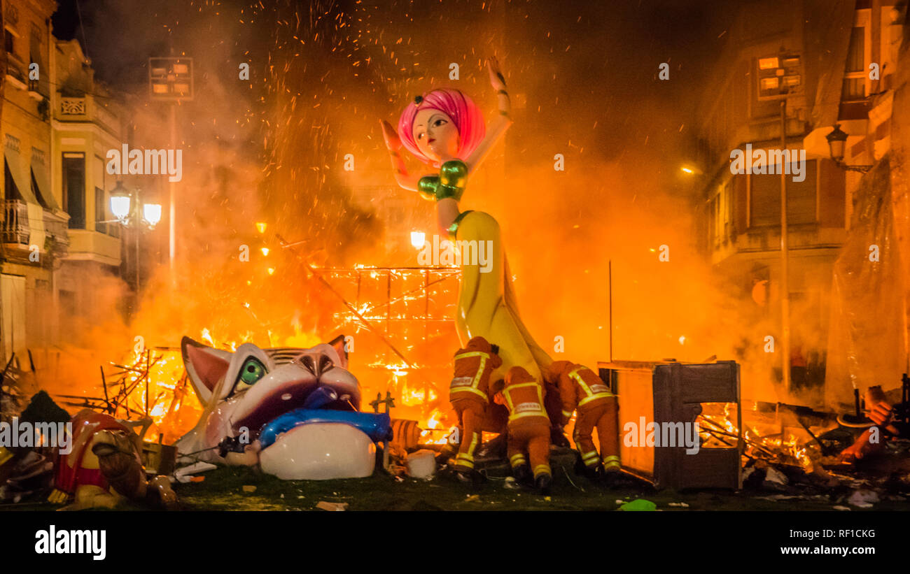 Fire men moving the rests of burning Falla Taut into the fire during la ...
