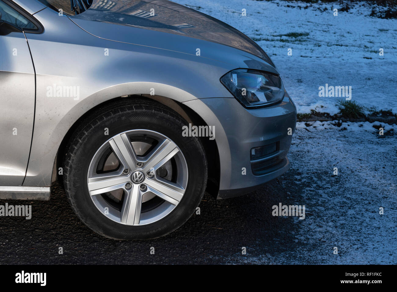 Detail of silver Volkswagen Golf parked on a winter day Stock Photo
