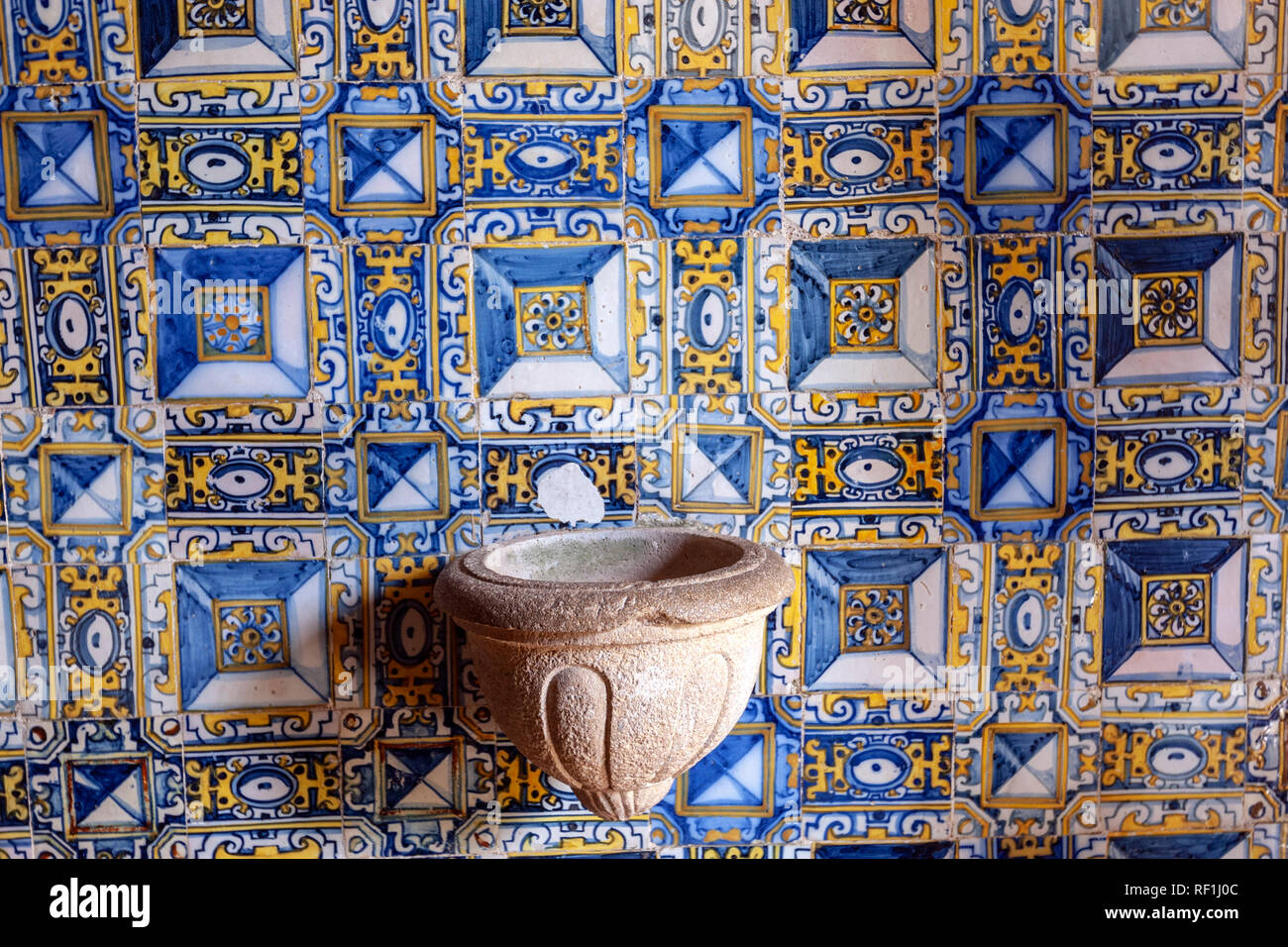 Holy water font and tiled wall in Portocarreiros Chapel w, Convent of Christ, Tomar, Portugal Stock Photo