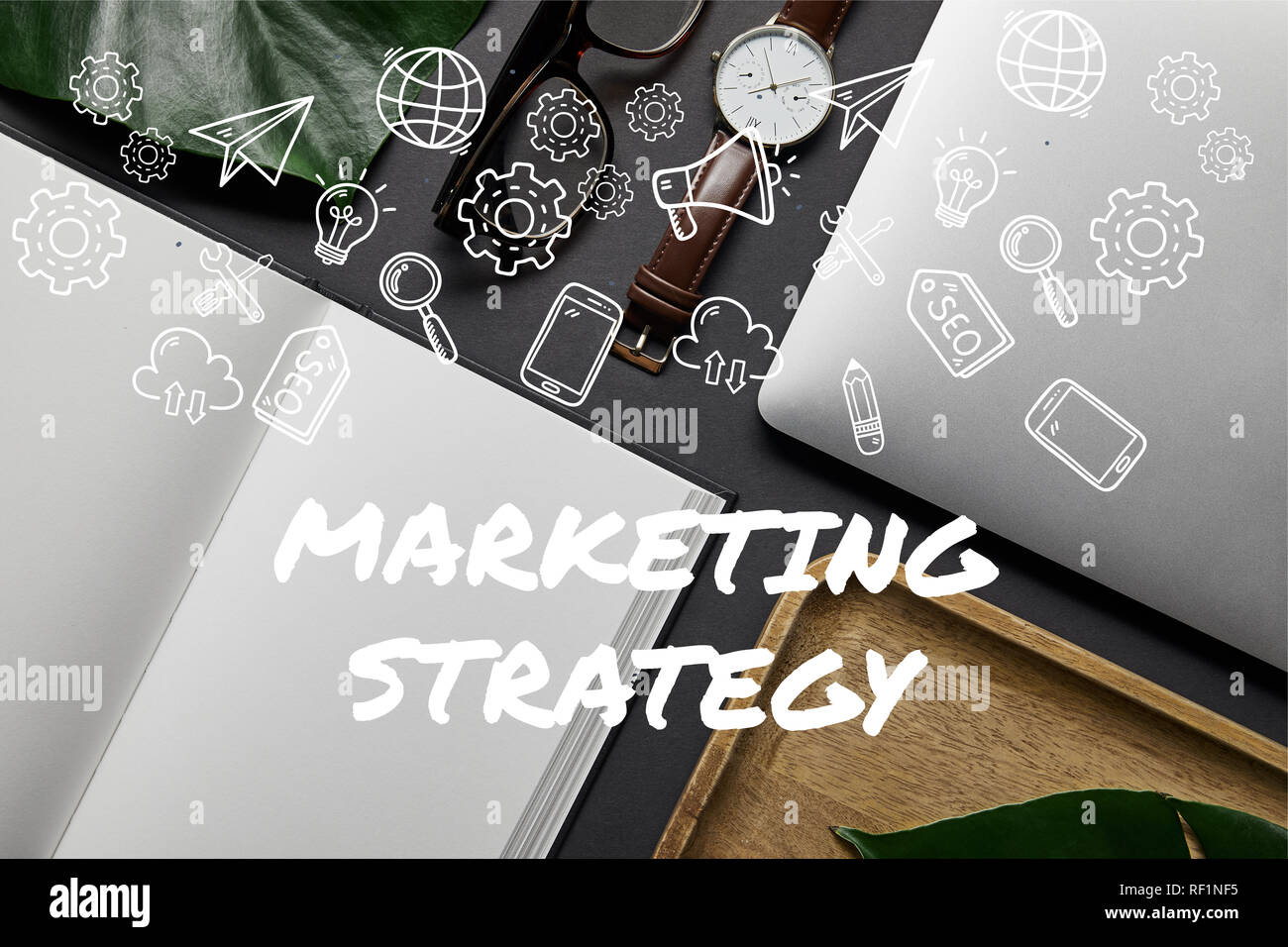 Flat lay with open notebook and laptop on black background with ...