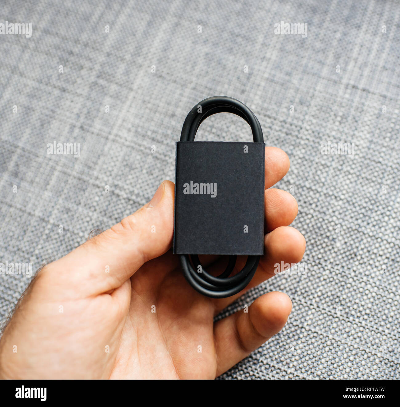Computer USB-C connection cable warped in black color Stock Photo - Alamy