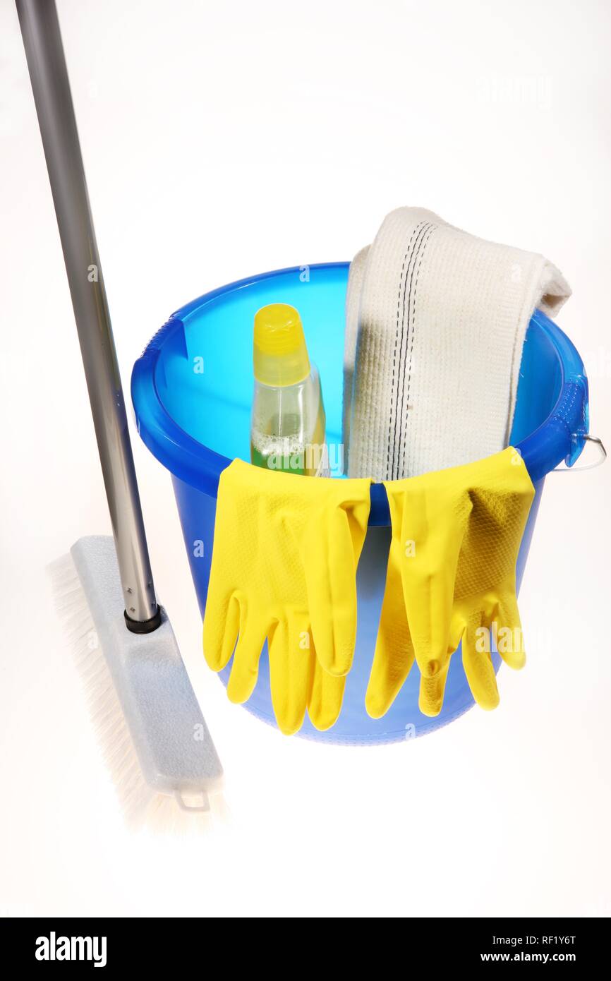 Broom and bucket used to scrub floors, yellow rubber gloves and