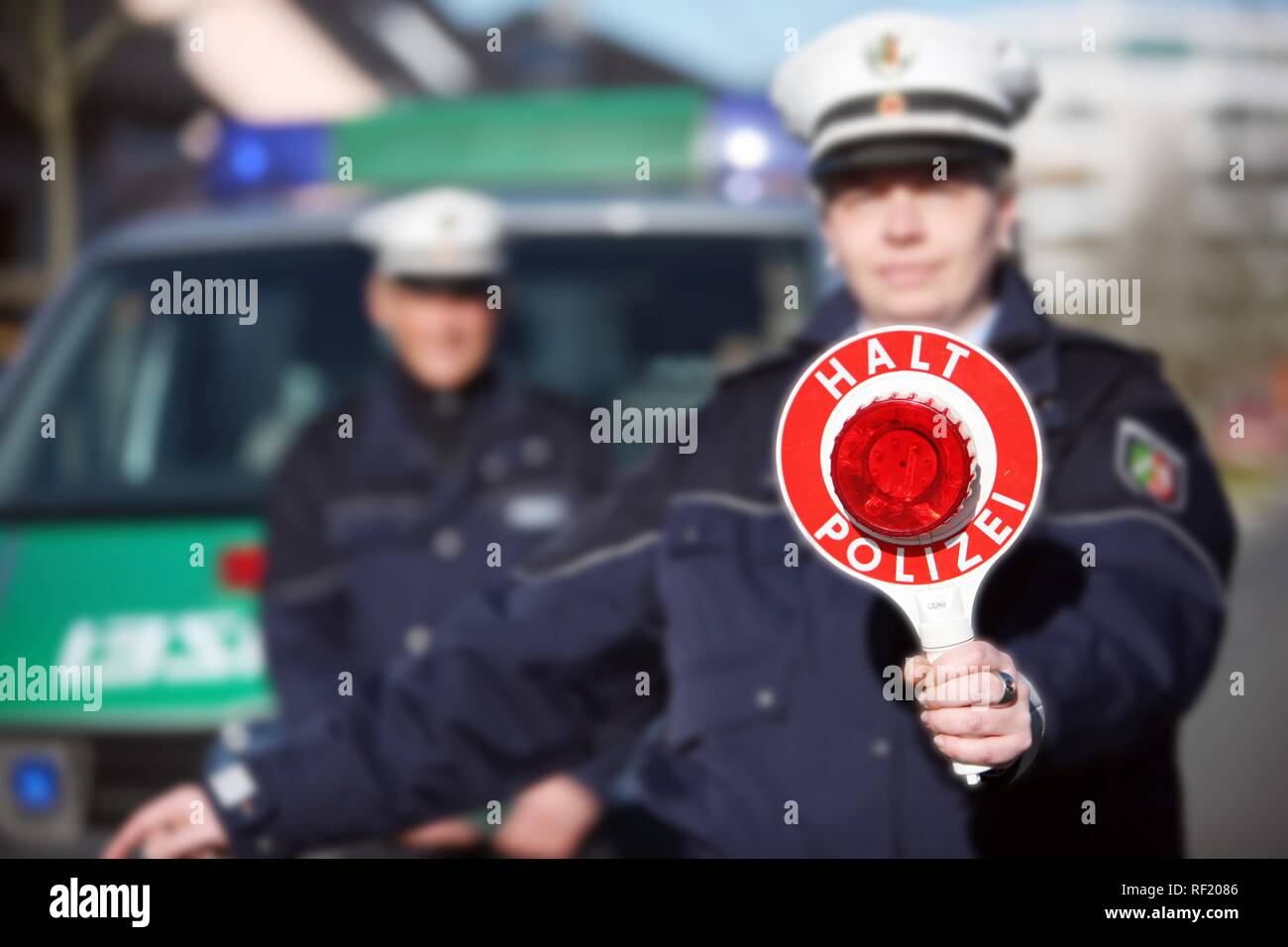 Vehicle spotcheck, police signaling cars to stop and pull over, Mettmann, North Rhine-Westphalia Stock Photo