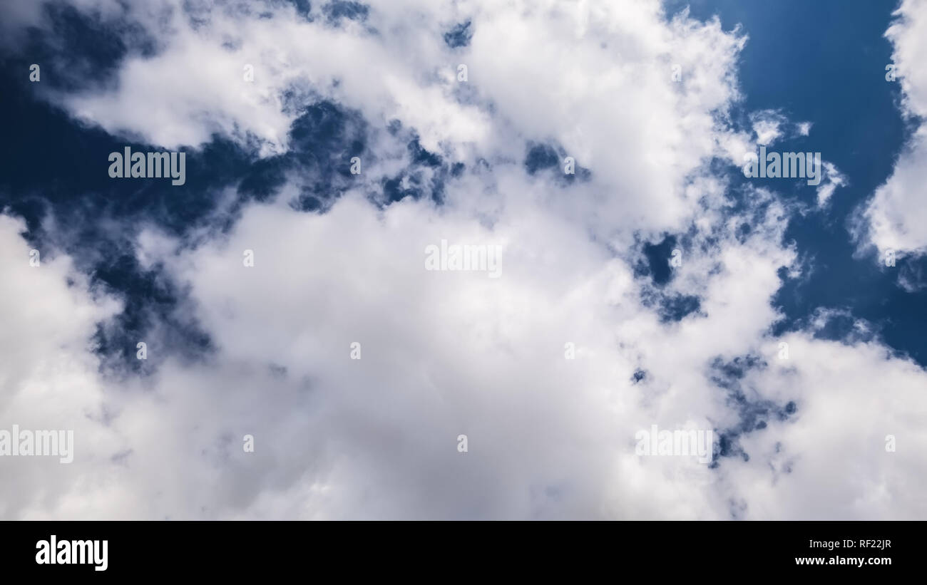 An image of a dark sky with white clouds Stock Photo - Alamy