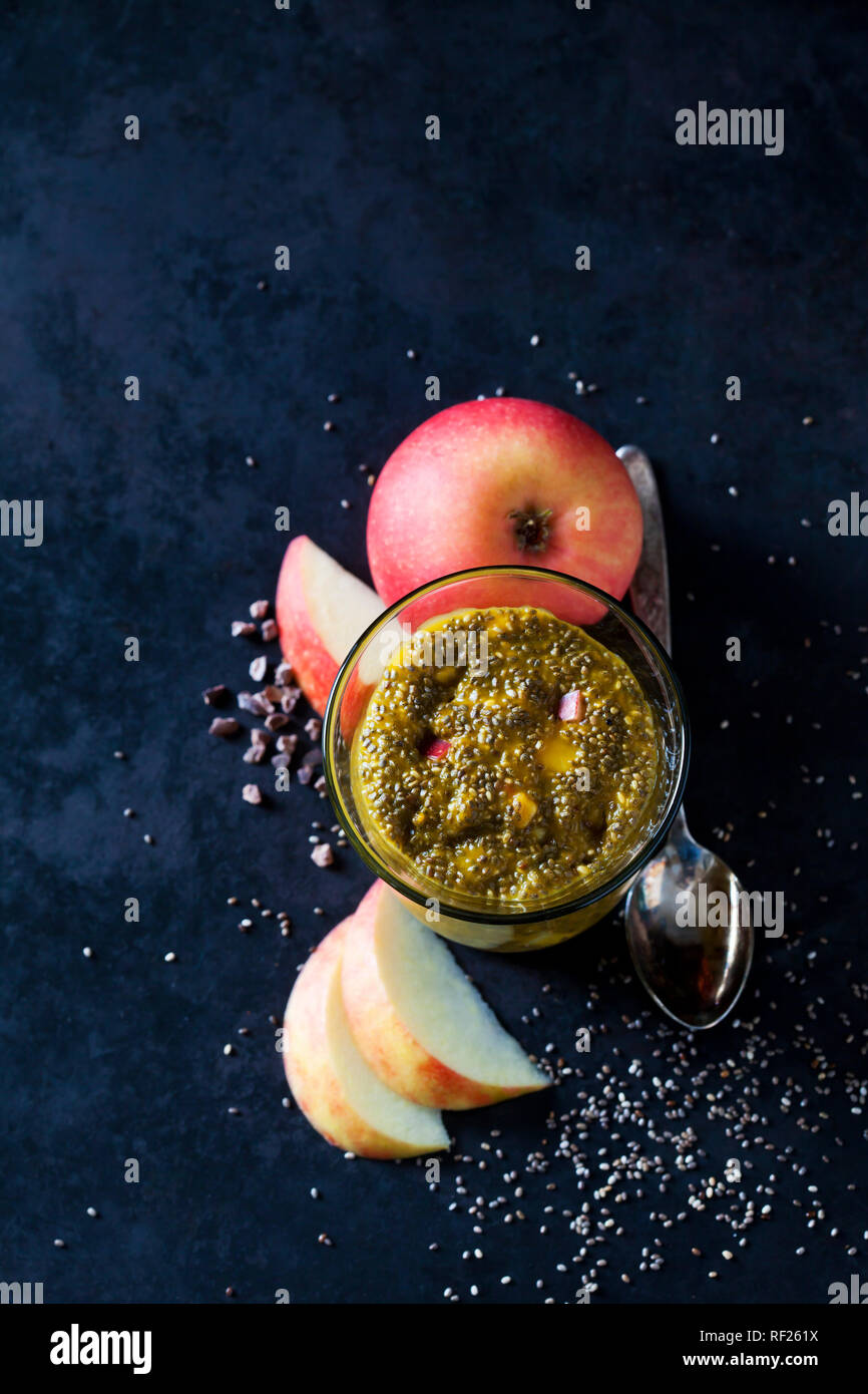 Dessert of chia seeds, chocolate, cacao nibs and apple Stock Photo