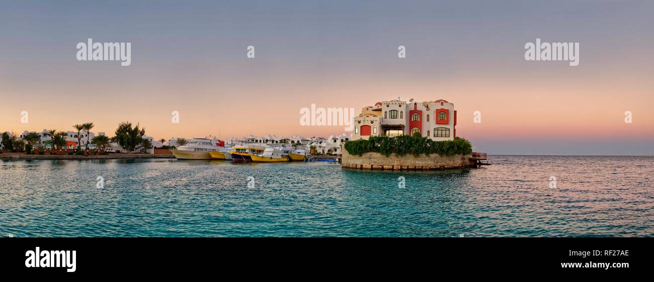Boat port with small peninsula at sunset, Blue Water Dive Resort, Hurghada, Red Sea, Egypt Stock Photo