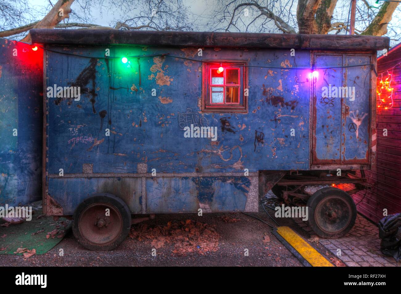 Old construction wagon with coloured chain of lights, Bremen, Germany Stock Photo