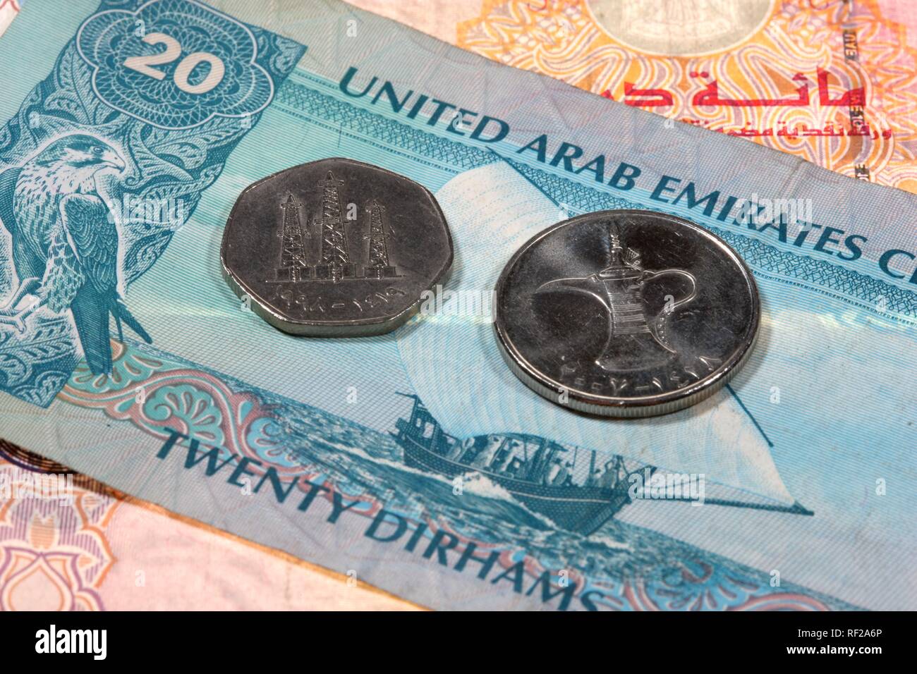 Dirham (or Dirhem) currency, AED, bills and coins featuring oil rig, oil derrick, United Arab Emirates (UAE) Stock Photo