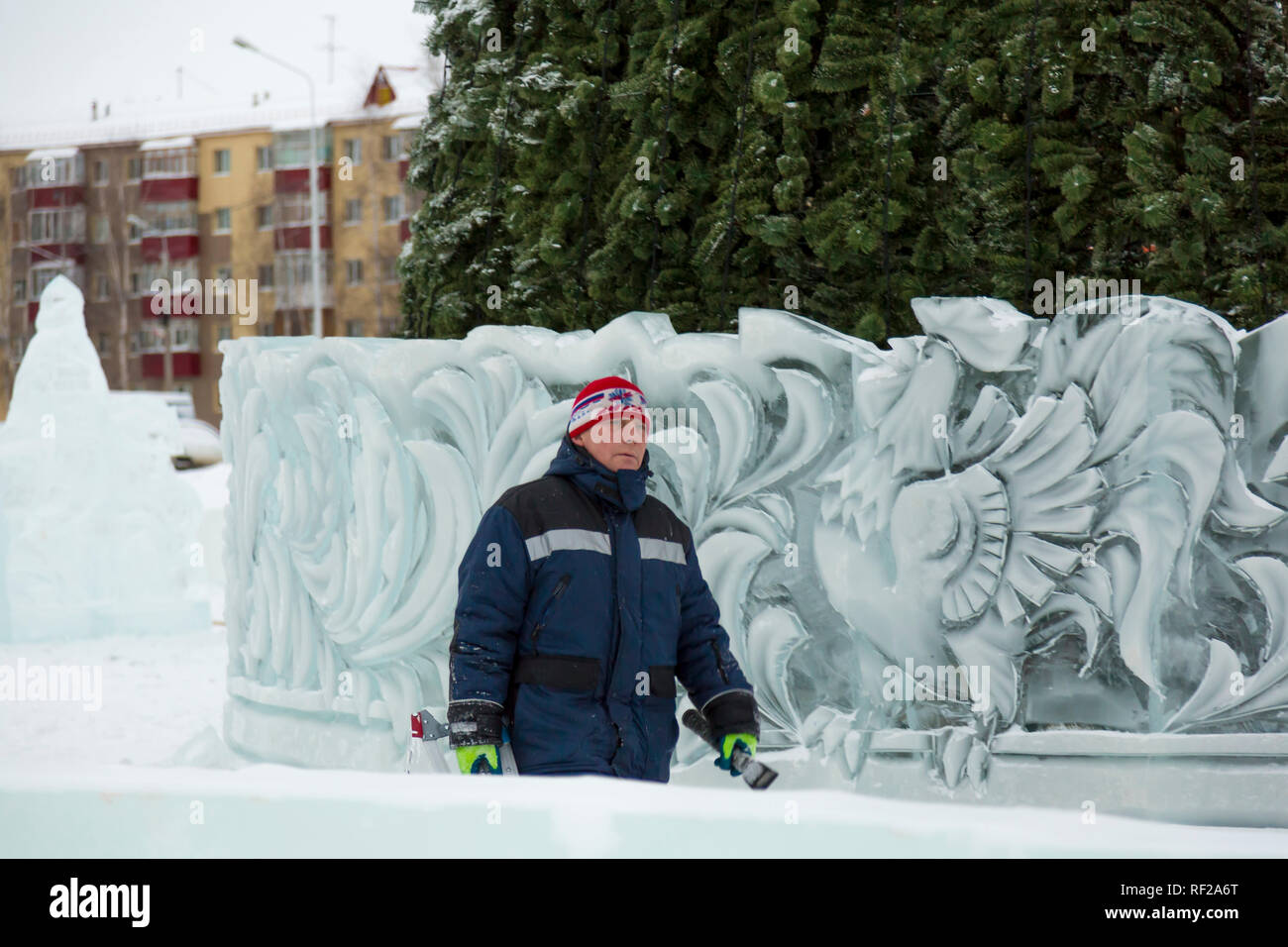 Winter Weather Assembly Portrait of a worker at an assembly site of an ice town in winter ...