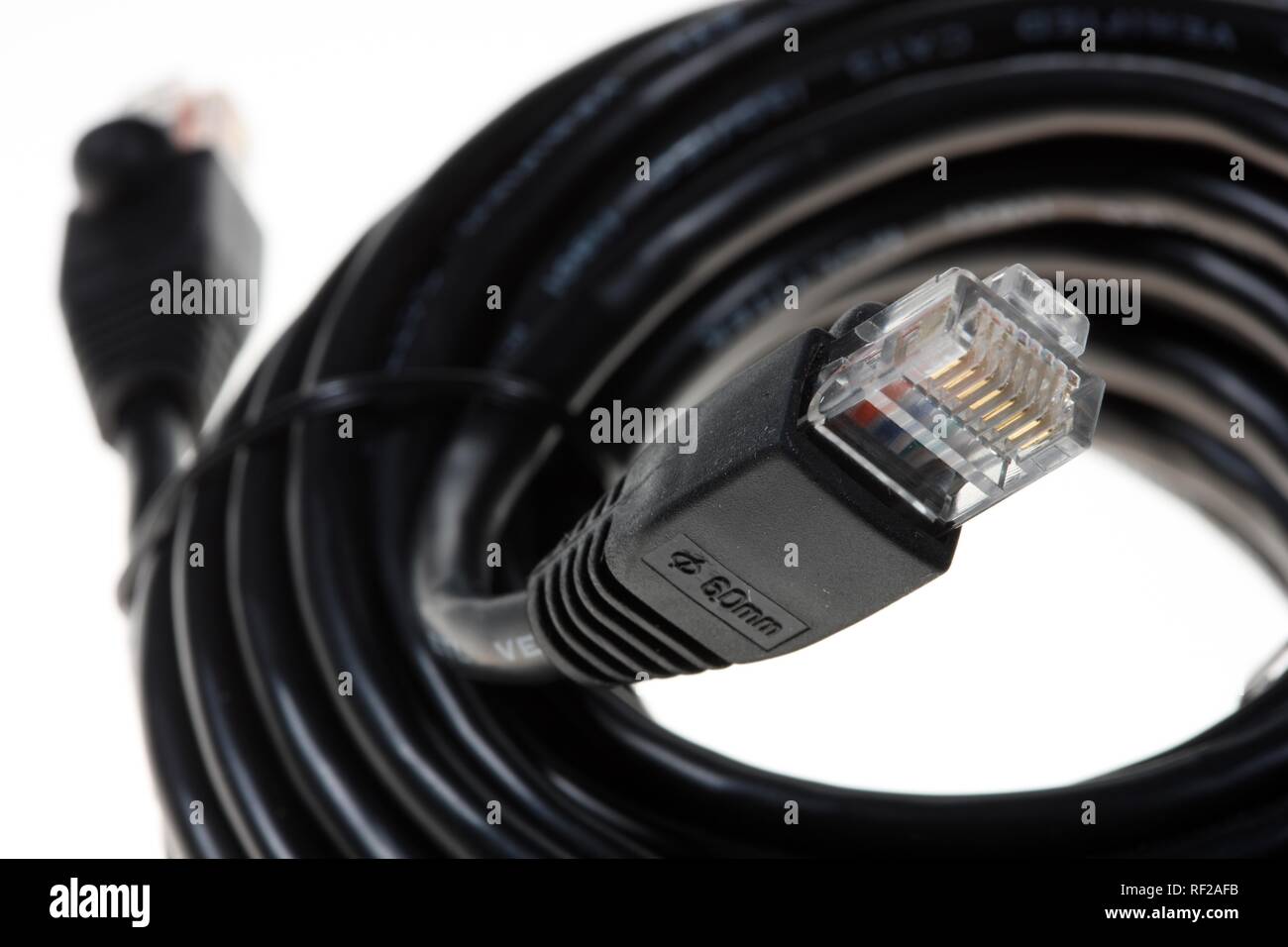 Coiled computer network cables used to connect to an internal or external network, internet connection, broadband connection Stock Photo