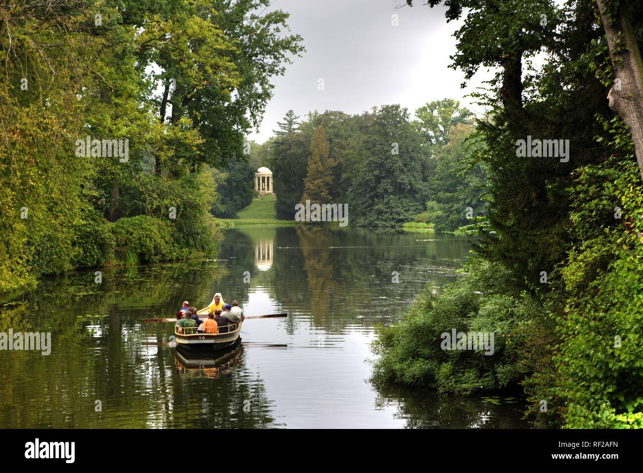 Rowboat going across the lakes and canals at Schoch's Garden, Kleines Walloch watercourse and the Venus Temple Stock Photo