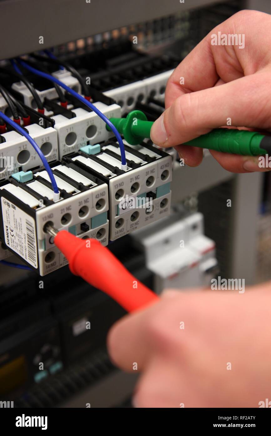 Measuring the voltage of electric circuits Stock Photo