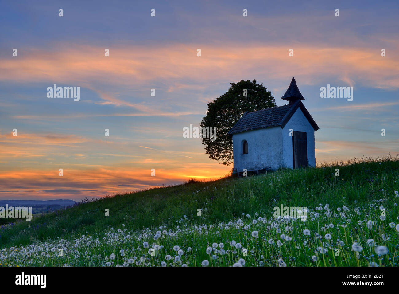 Germany, Upper Bavaria, Aidlinger Hoehe, Chapel at sunset Stock Photo