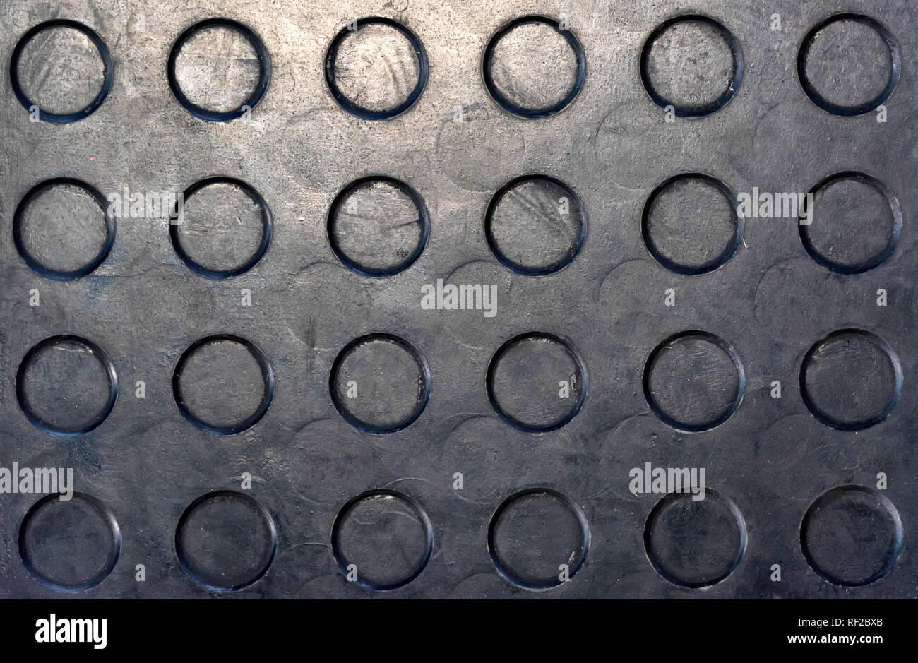 Close up black rubber mat texture with circles Stock Photo