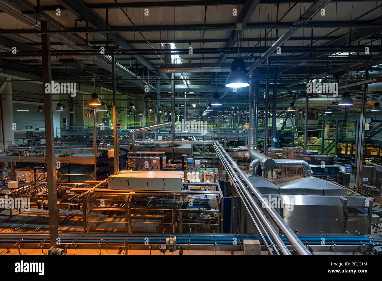 Industrial interior of soft drinks factory with tubes Stock Photo
