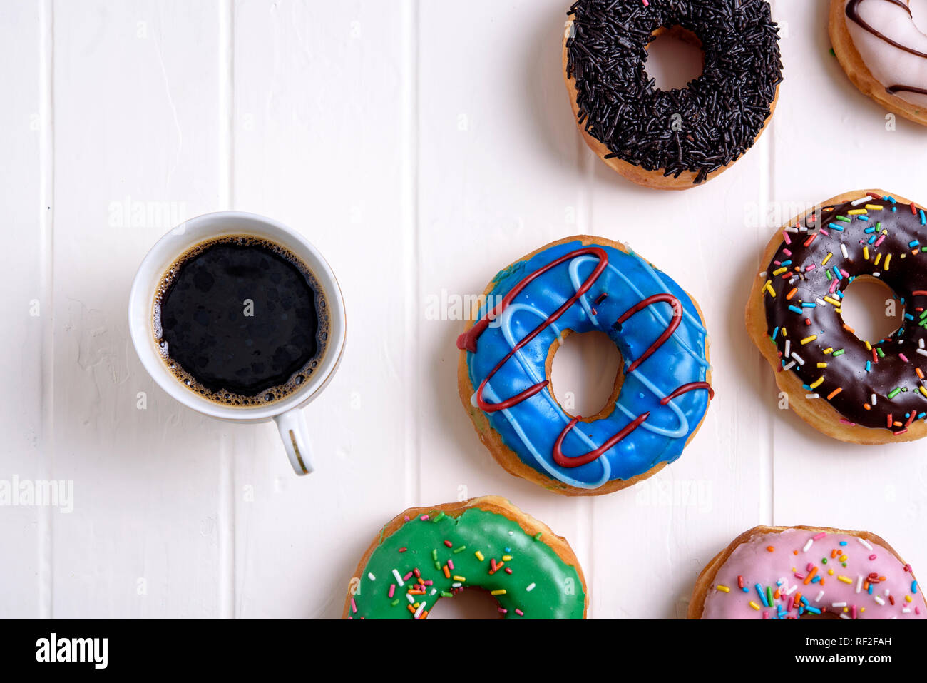 Colorful Donuts with Coffee Stock Photo