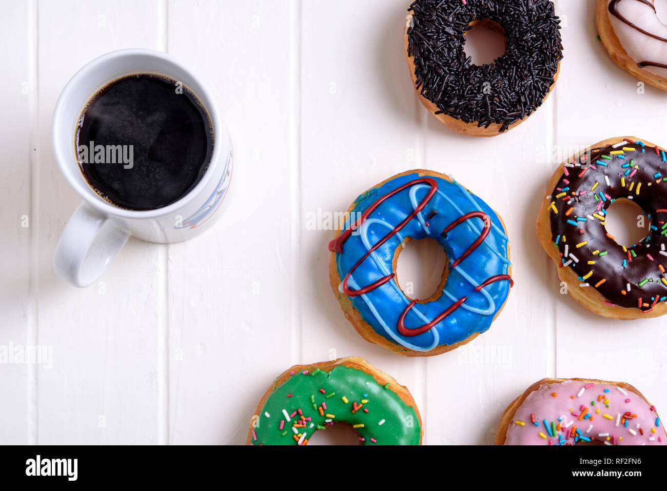 Colorful Donuts with Coffee Stock Photo