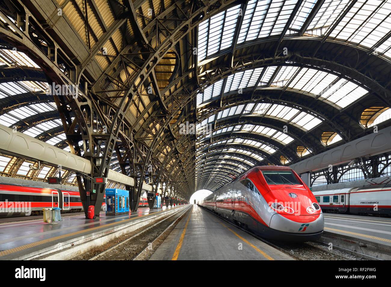 Hall in the central railway station, Stazione Centrale, with Frecciarossa high-speed trains, Milan, Lombardy, Italy Stock Photo