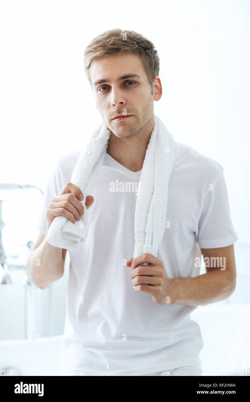 Handsome guy in the bathroom Stock Photo - Alamy