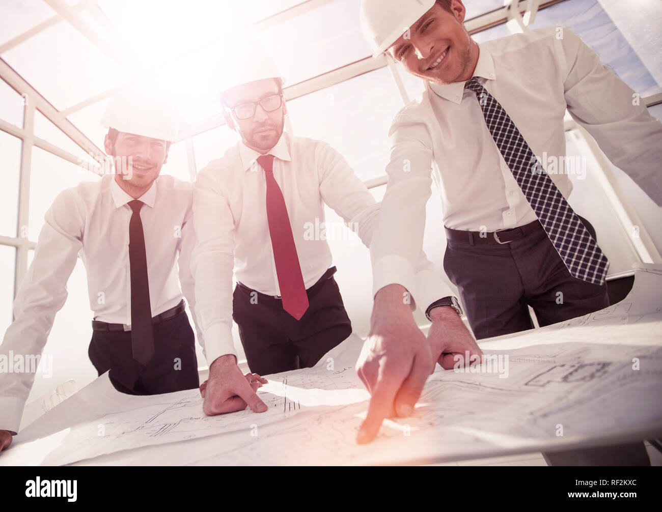 group of architects discussing sketches Stock Photo