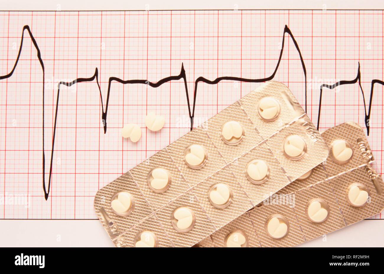 Beta blockers, blister pack on an ECG printout Stock Photo