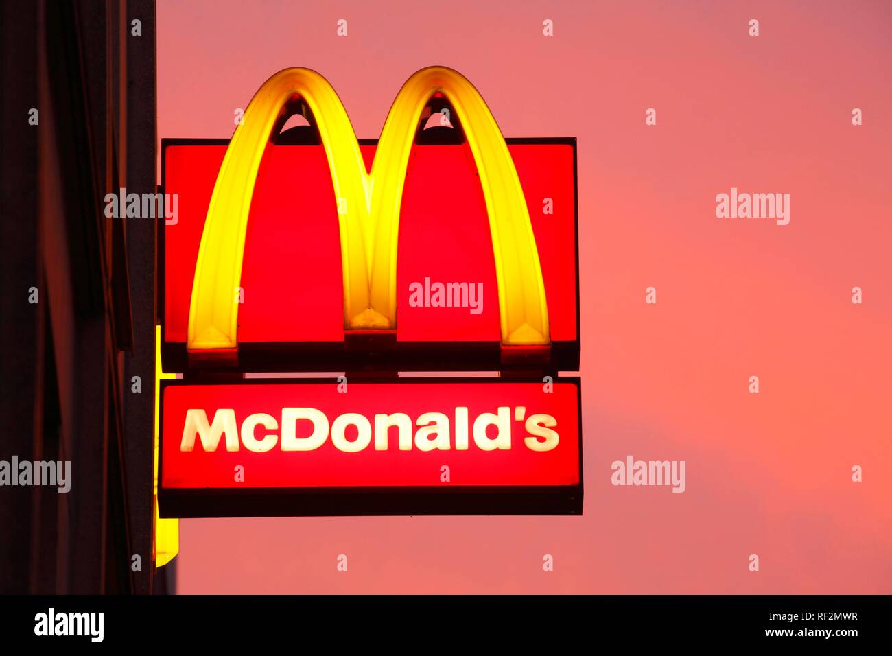 Logo of Mc Donald's at dusk, Germany Stock Photo