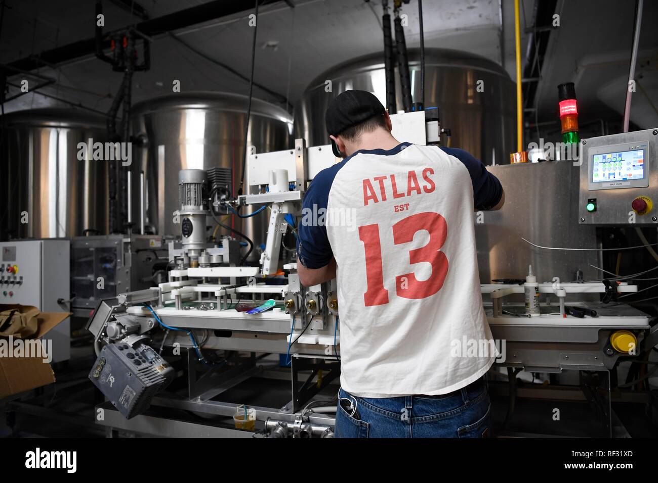 (190123) -- WASHINGTON, Jan. 23, 2019 (Xinhua) -- A staff works at Justin Cox's brewery in Ivy City in northeastern Washington, DC, the United States, Jan. 17, 2019. Located in the community of Ivy City in northeastern Washington, DC, Justin Cox's 12-feet-tall (around 3.66 meters tall) brewery has 14 production tanks, with a strong hop aroma filling the air. His craft brewing business has been running smoothly for over five years until just recently. Without approved labels from the federal government, kegs of apricot-flavored India Pale Ale (IPA) have piled up in his warehouse, unable to be Stock Photo