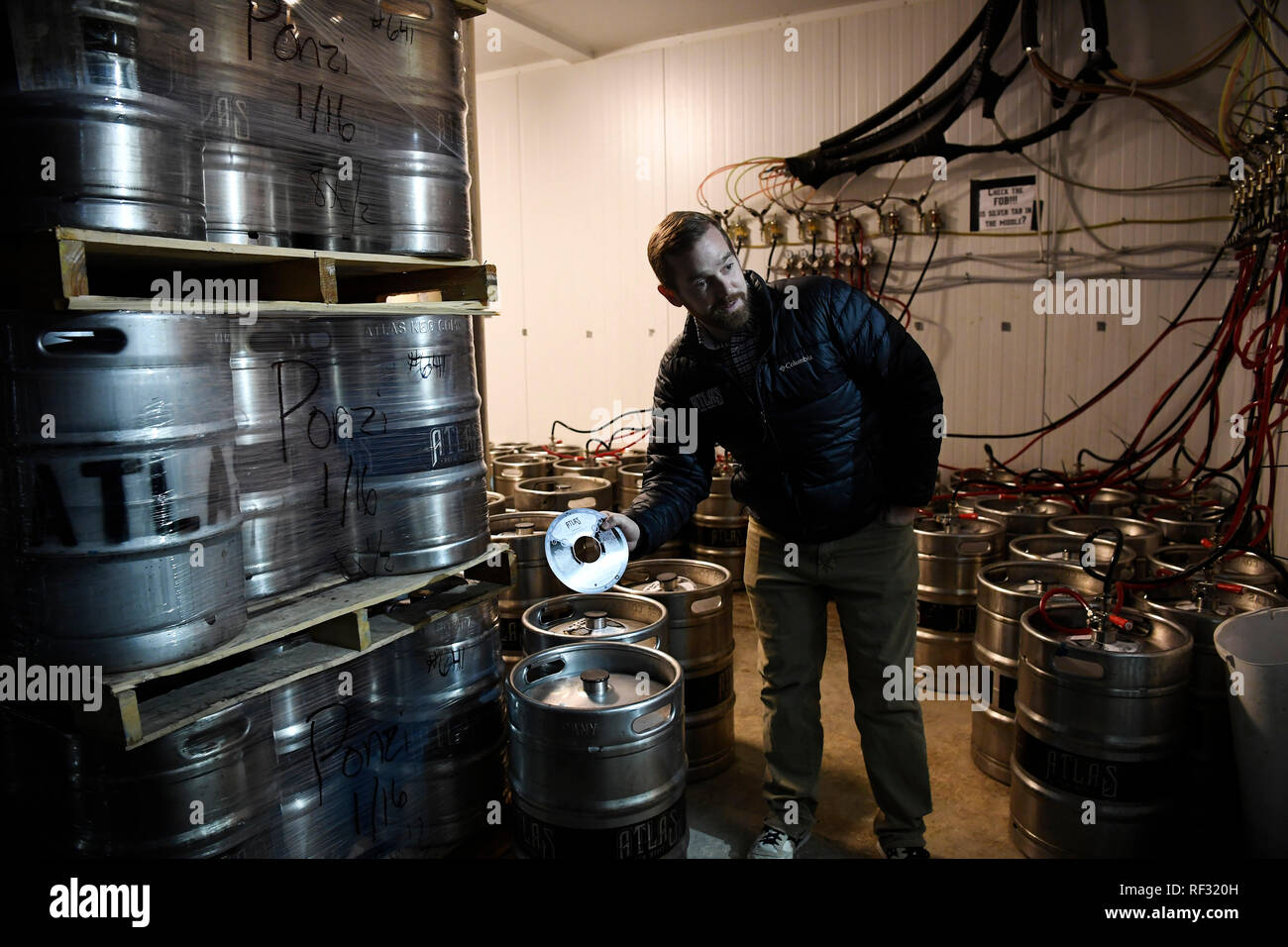 (190123) -- WASHINGTON, Jan. 23, 2019 (Xinhua) -- Justin Cox, owner of a craft brewing business, shows a keg label approved by the Treasury Department's Alcohol and Tobacco Tax and Trade Bureau (TTB) before government shutdown in Ivy City in northeastern Washington, DC, the United States, Jan. 17, 2019. Located in the community of Ivy City in northeastern Washington, DC, Justin Cox's 12-feet-tall (around 3.66 meters tall) brewery has 14 production tanks, with a strong hop aroma filling the air. His craft brewing business has been running smoothly for over five years until just recently. With Stock Photo