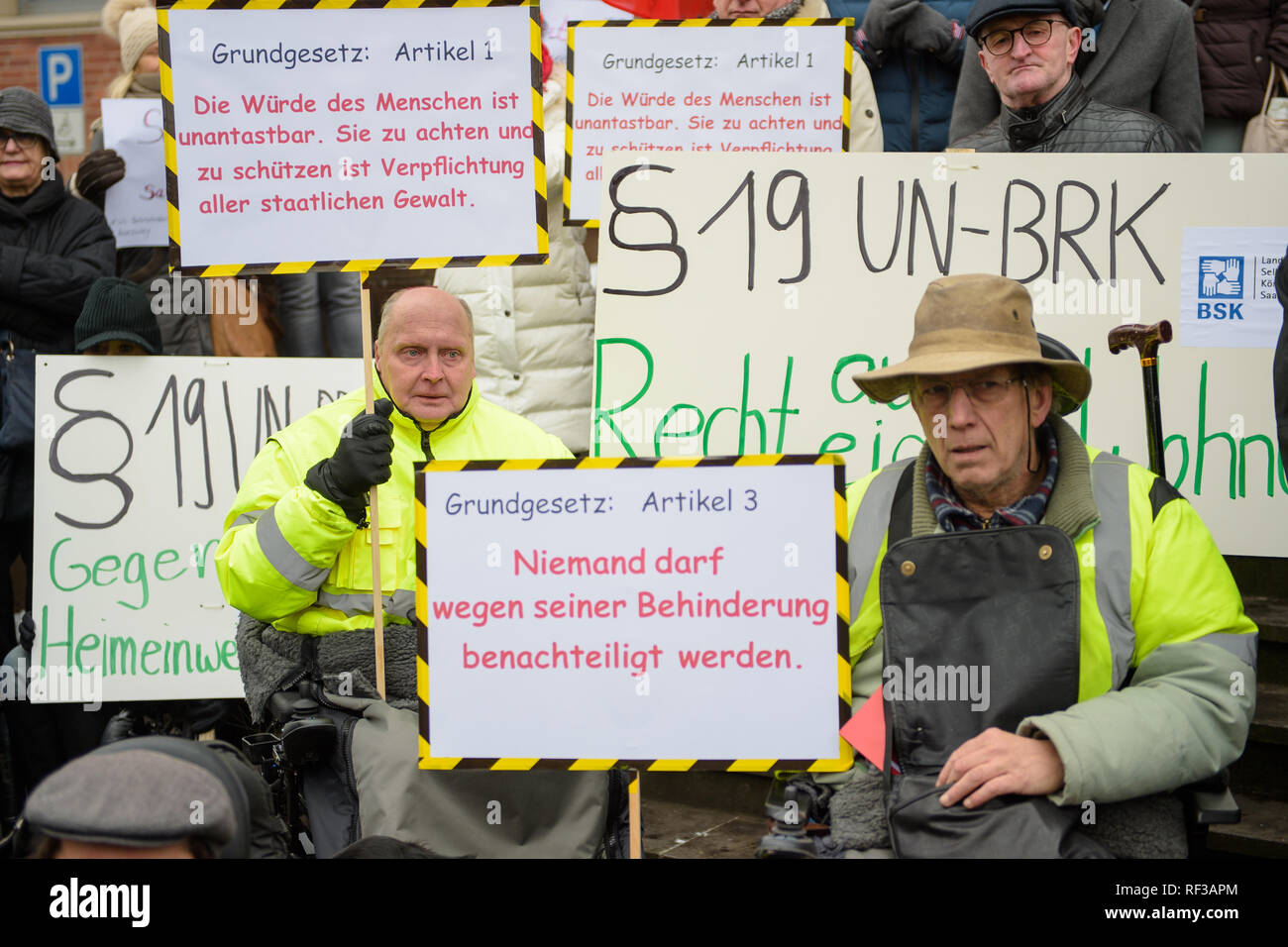 24 January 2019, Saarland, Saarbrücken: Many supporters demonstrate in front of the Saarland State Office for Social Affairs that the office will cover the costs for a round-the-clock care of a severely handicapped person and thus enable him to continue living in his own four walls. Photo: Oliver Dietze/dpa Stock Photo