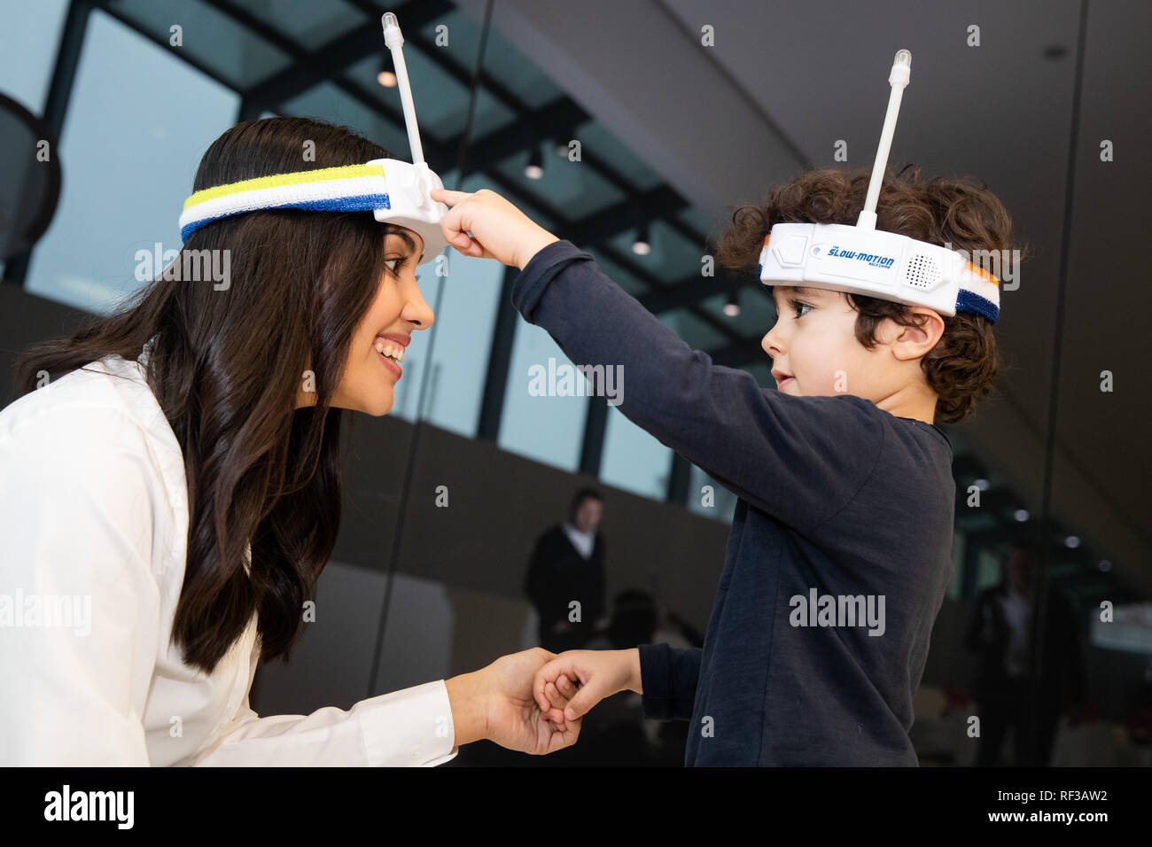 24 January 2019, Bavaria, Nürnberg: Model Jennifer and Kaan will play the 'Slow Motion Race Game' from Hasbro on the sidelines of the press conference for the International Toy Fair 2019 in the Exhibition Centre Nuremberg. A sensor on the antenna of a headband measures the speed of the player's movement - but the winner is not the fastest but the slowest. The toy is nominated in the category 'Schoolkids' for the 'Toy Award'. The world's largest toy fair takes place this year from 30 January to 03 February 2019. Photo: Daniel Karmann/dpa Stock Photo