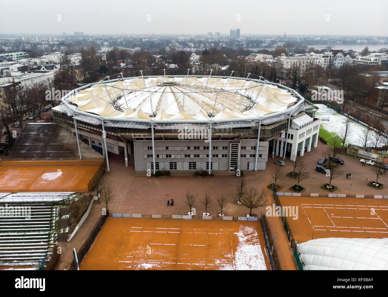 24 January 2019, Hamburg: View of the tennis court at Rothenbaum with the  outdoor courts (front) and the Center Court (back) with the closed roof  (shot with a drone). The German Tennis