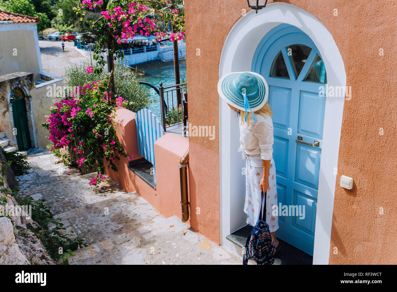 Blonde stylish woman on summer vacation on Kefalonia Island. Beautiful tanned woman enjoying the day, Greece, Europe Stock Photo