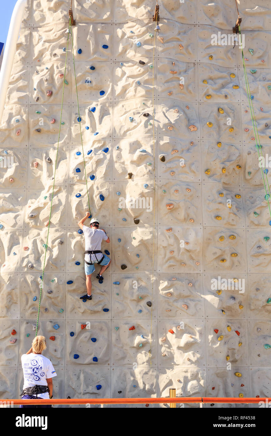 Man on Rock Climbing Wall Stock Photo