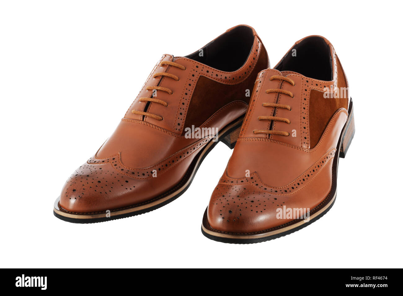 Pair of brown leather men's shoes brogues on a white background with