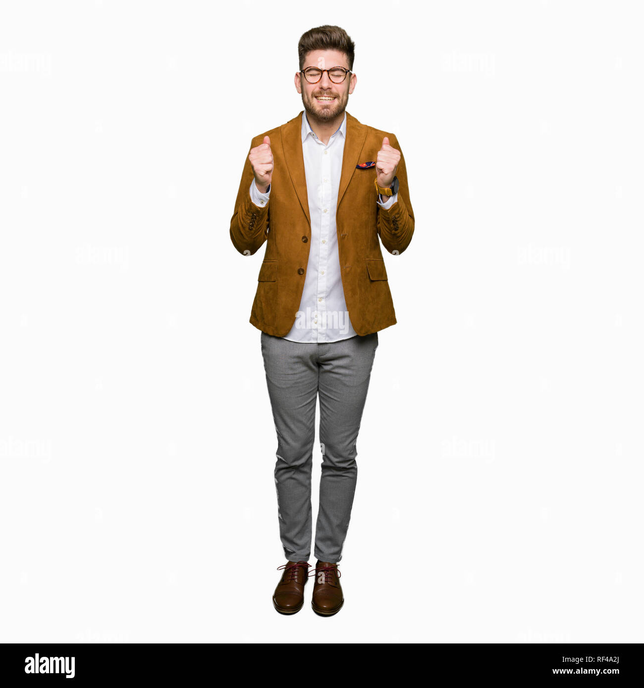 Young handsome business man wearing glasses excited for success with ...