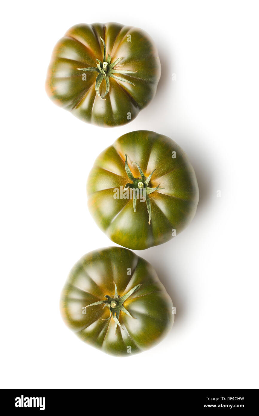 Dark brandywine tomatoes isolated on white background. Stock Photo
