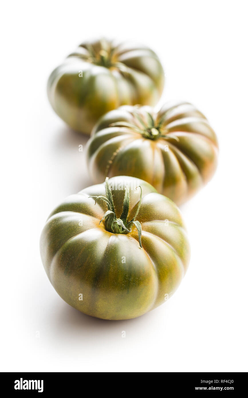 Dark brandywine tomatoes isolated on white background. Stock Photo