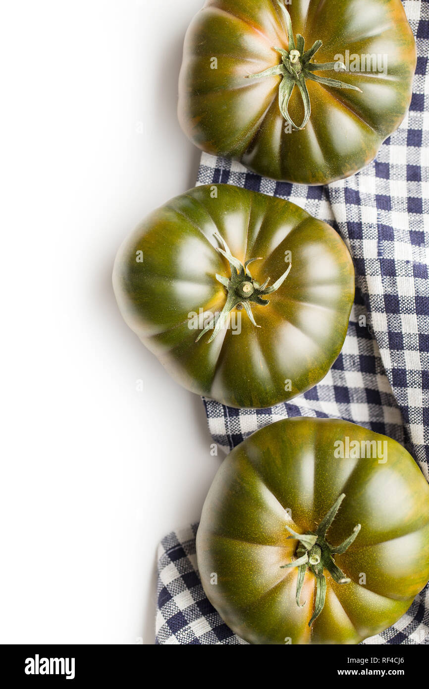 Dark brandywine tomatoes isolated on white background. Stock Photo
