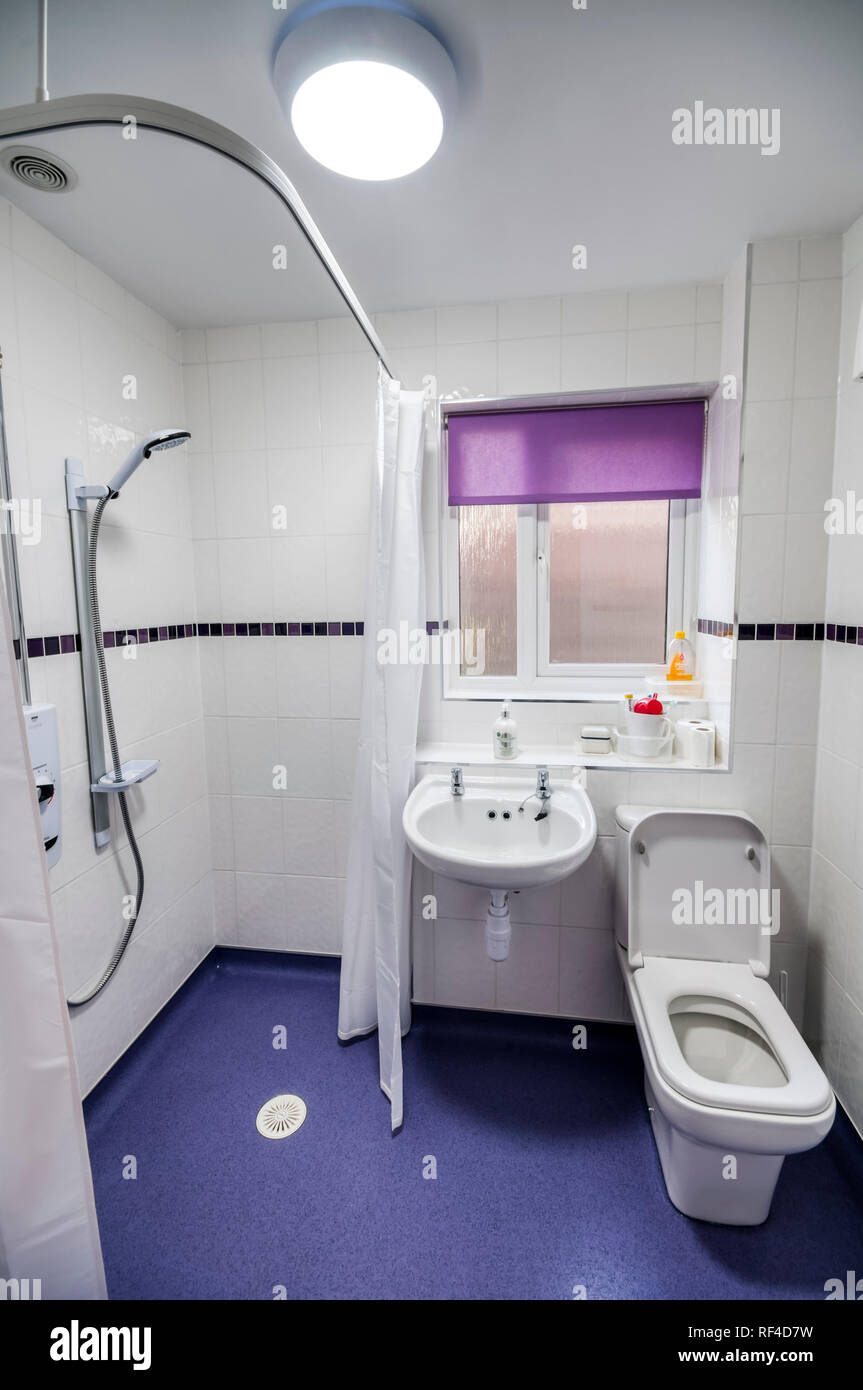 A wet shower room adaptation of a bathroom for use by a disabled or elderly person. Stock Photo