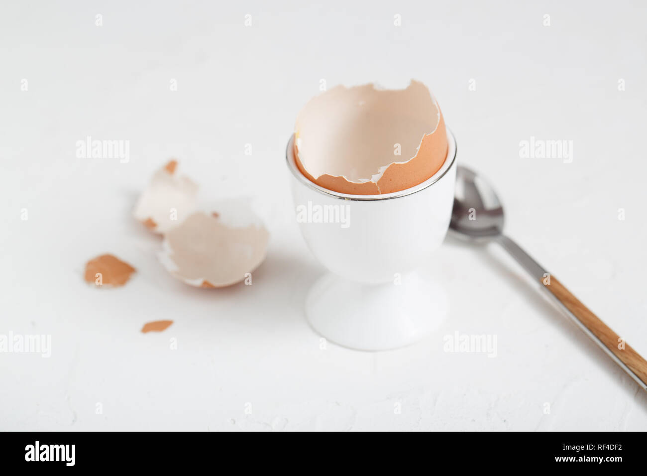 Empty eg shell or eaten eg on white background. copy space Stock Photo