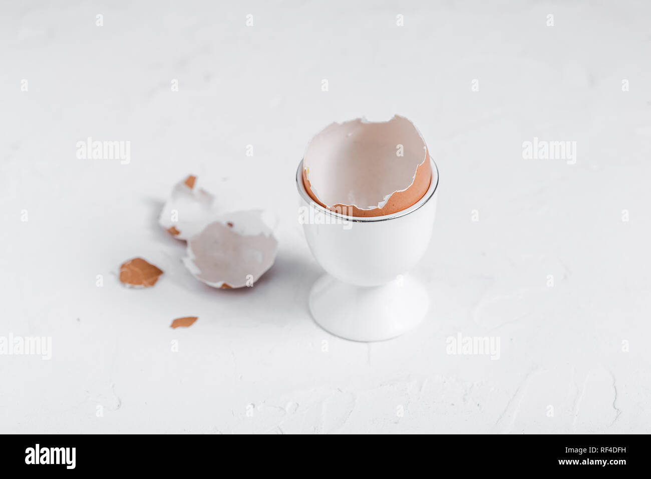 Empty eg shell or eaten eg on white background. copy space Stock Photo