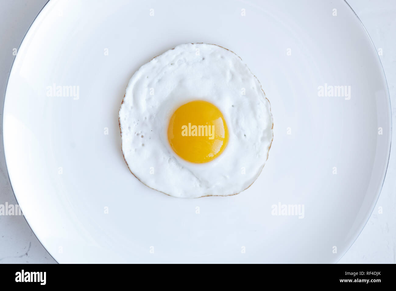 Fried egg isolated on white background, top view Stock Photo - Alamy