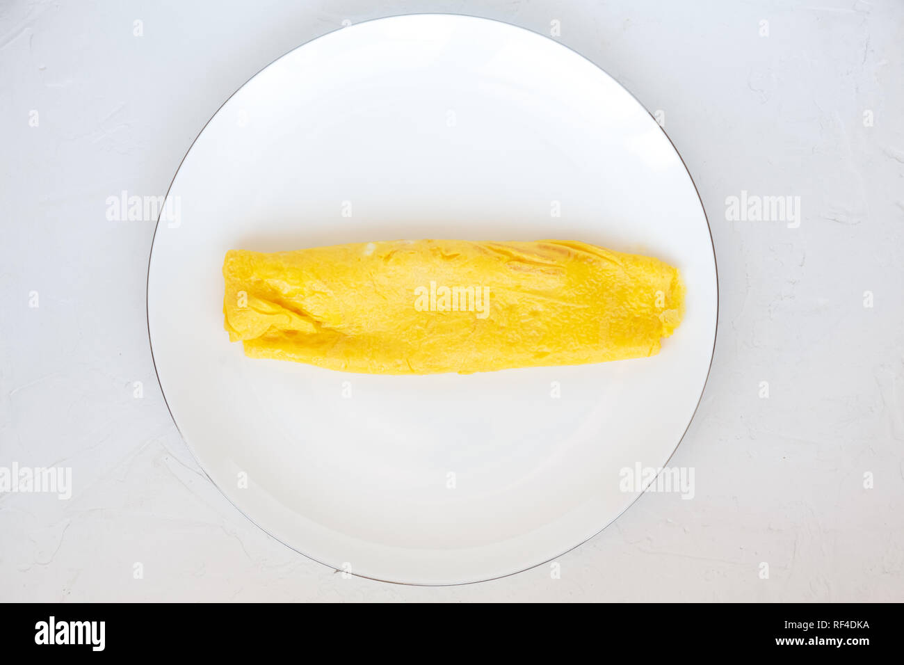 Simple french egg omelette on white background Stock Photo Alamy