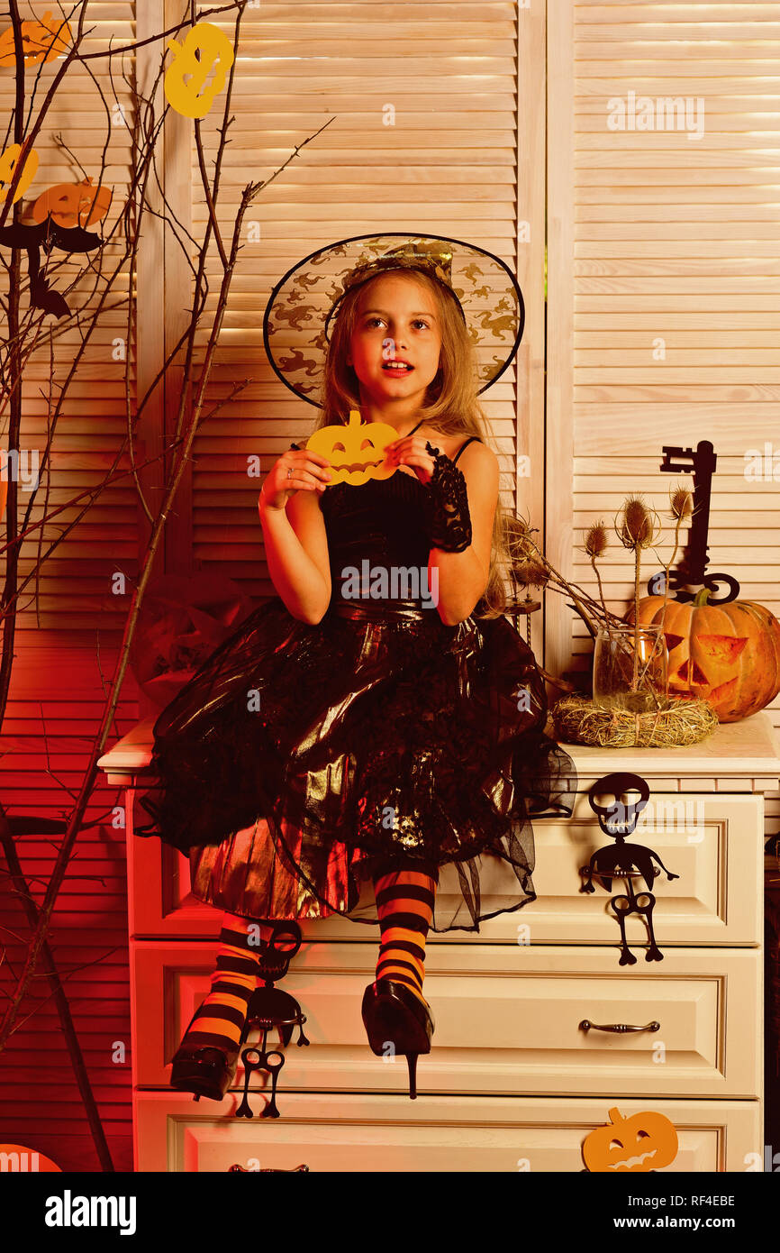 Little girl ready for halloween party. Little girl in witch hat have