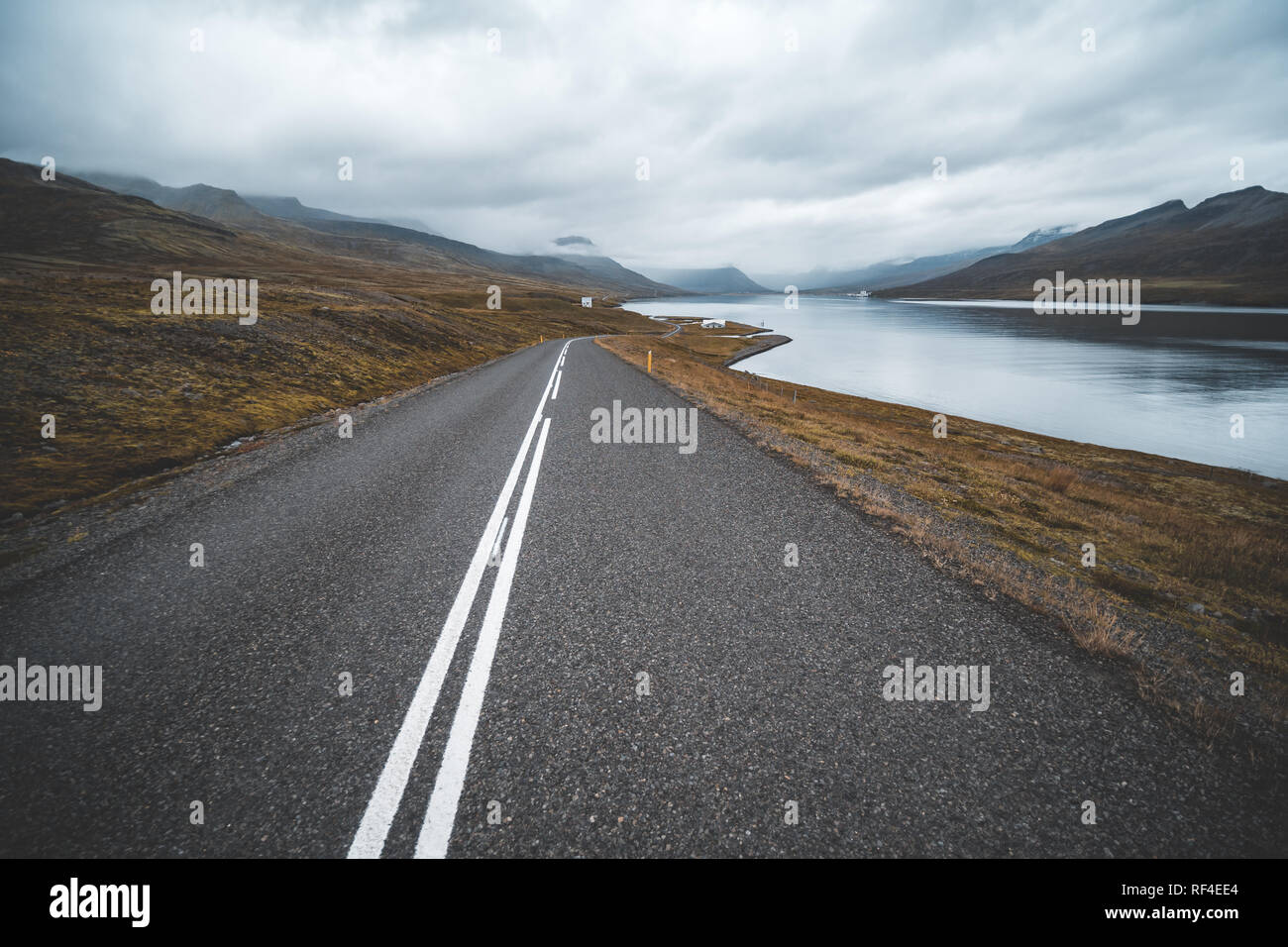 Empty road passing through amazing landscape in Iceland Stock Photo