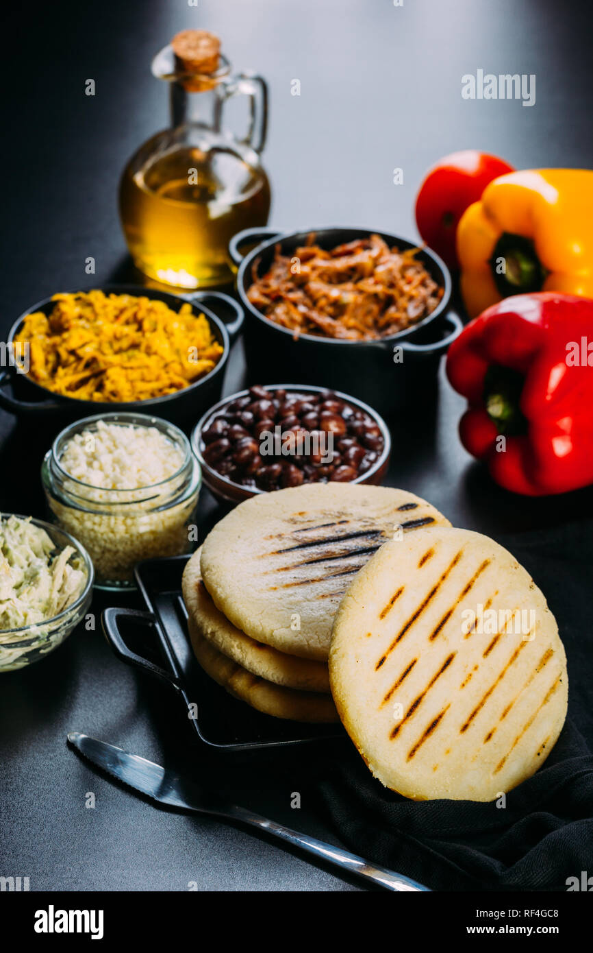 typical breakfast of Venezuela and Colombia, Arepas with many ingredients to fill them Stock Photo
